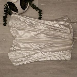 Corset top in white. Zipper front tie back Size 2